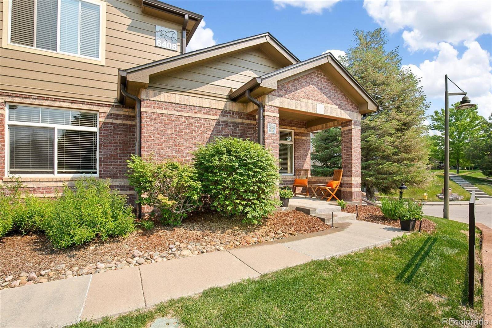 End-unit exterior with landscaped entry