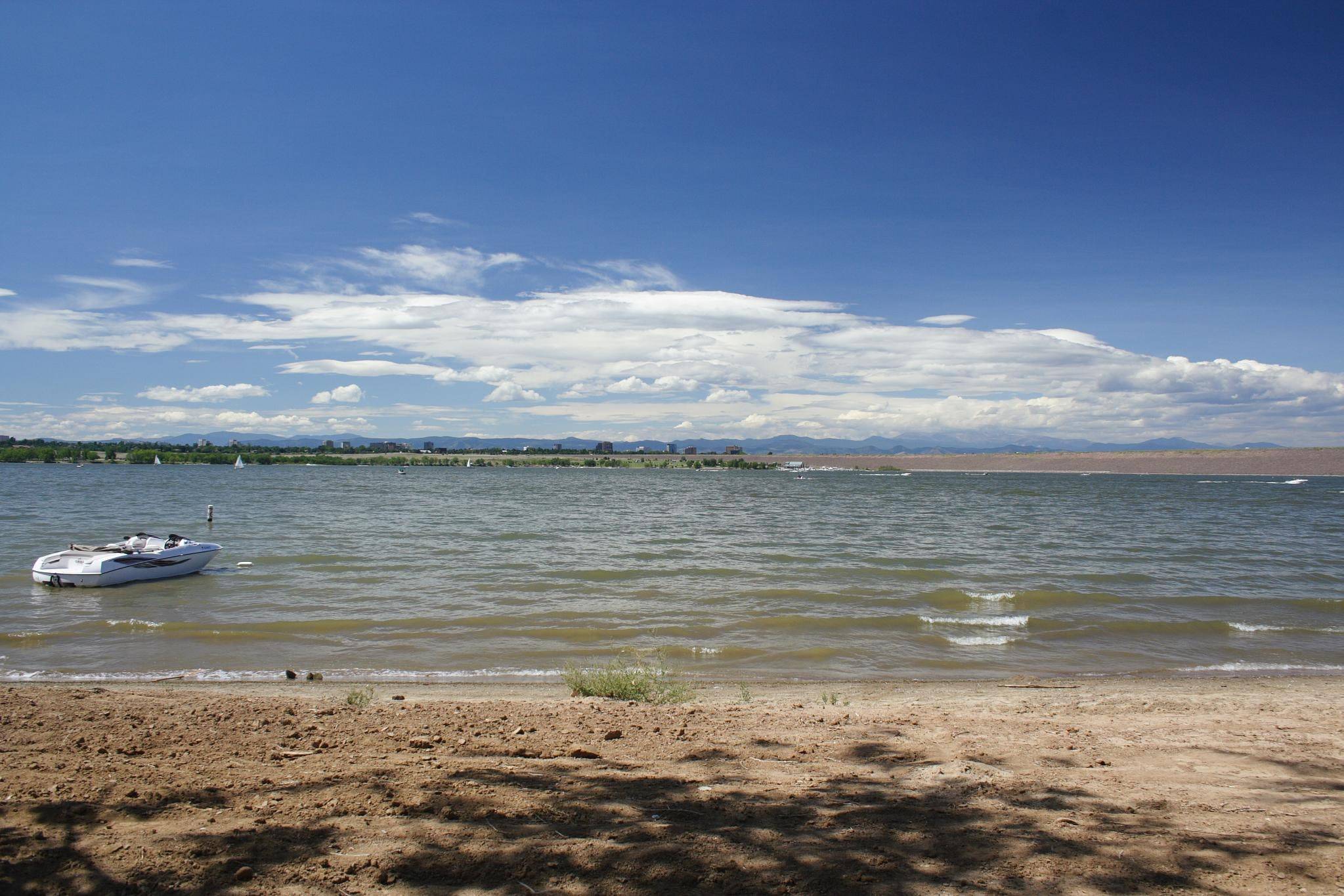 Beach and open water at Cherry Creek State Park under a blue sky